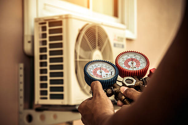 Professional Air Conditioning Service technician working in Jonesboro, IL